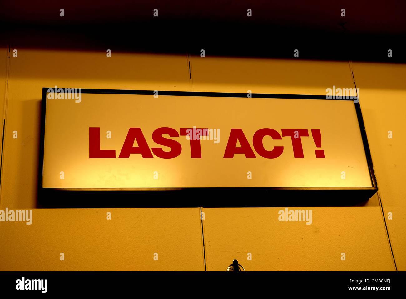 Interior sign at a Macy's Department store where last chance bargains can be found; Last Act!; end of the road, the end, no more, death concept. Stock Photo