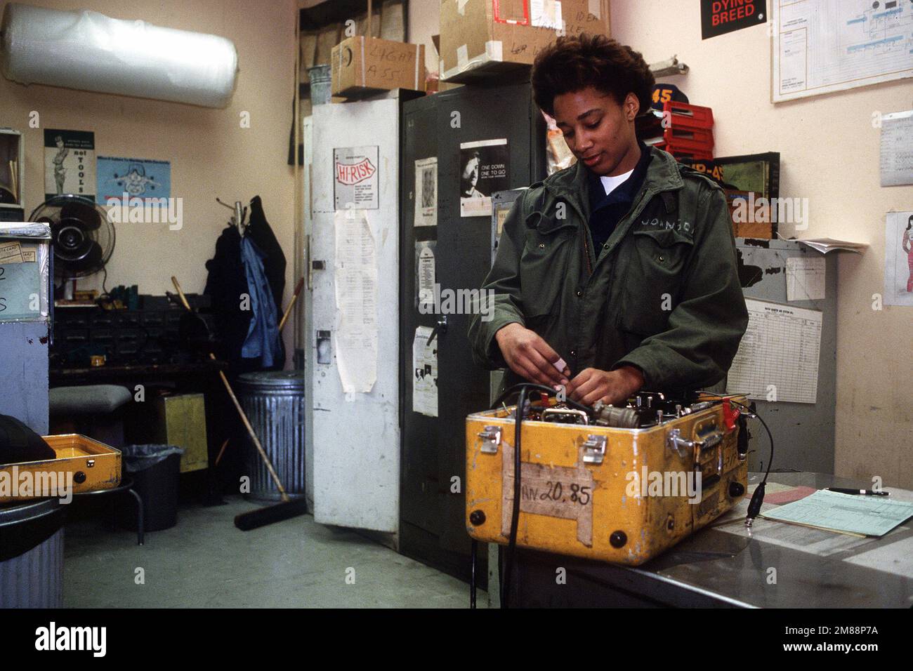 Aviation Electrician's Mate/AIRMAN Rachael M. Johnson checks over test equipment used to diagnose the cause of malfunctions on P-3 Orion aircraft of Patrol Squadron 45. Base: Naval Air Station, Sigonella State: Sicily Country: Italy (ITA) Stock Photo