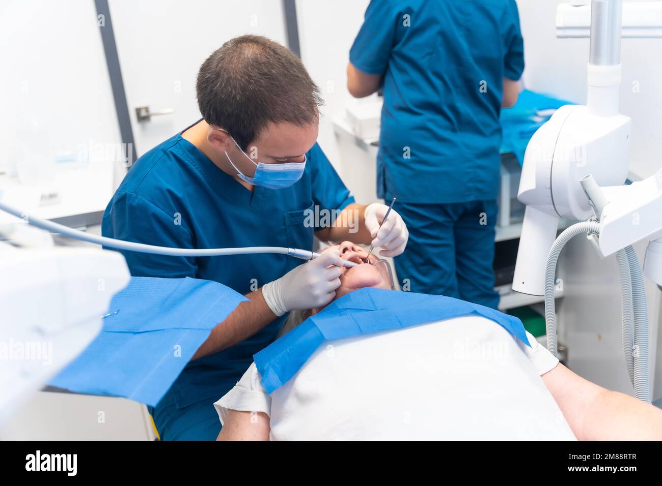 Dental clinic, elderly woman at dentist with doctor on routine denture