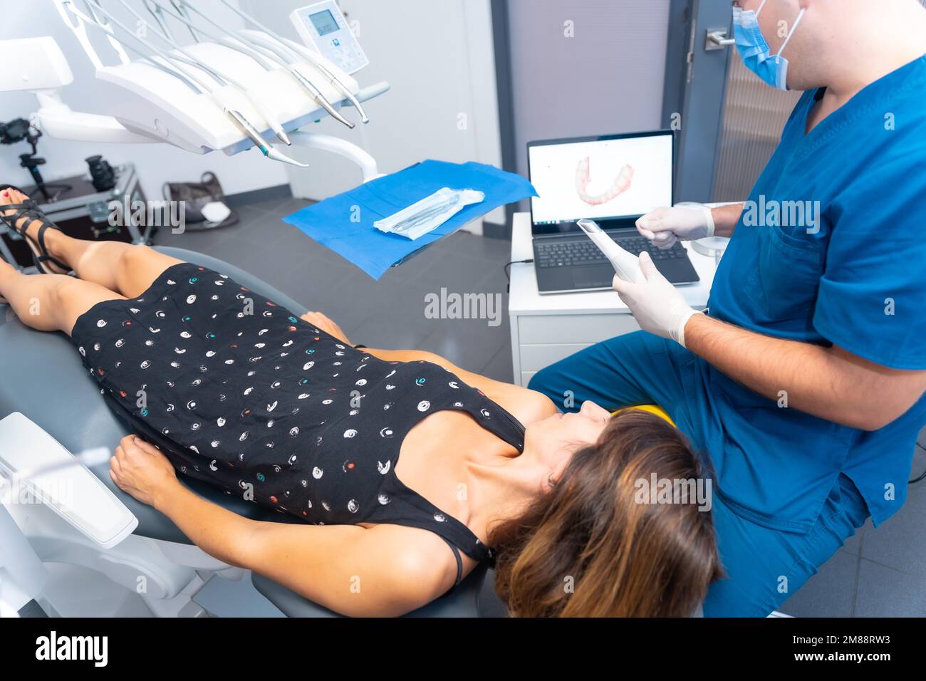 Dental clinic, dentist performing a 3d scan to the patient with the computer Stock Photo
