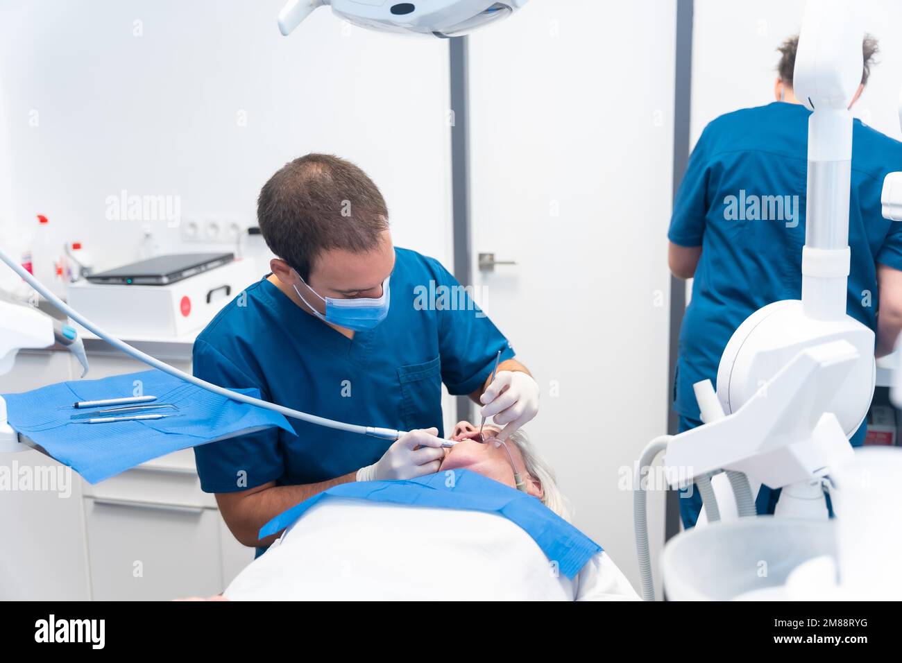 Dental clinic, elderly woman at the dentist checking the implants with the dentist doctor Stock Photo