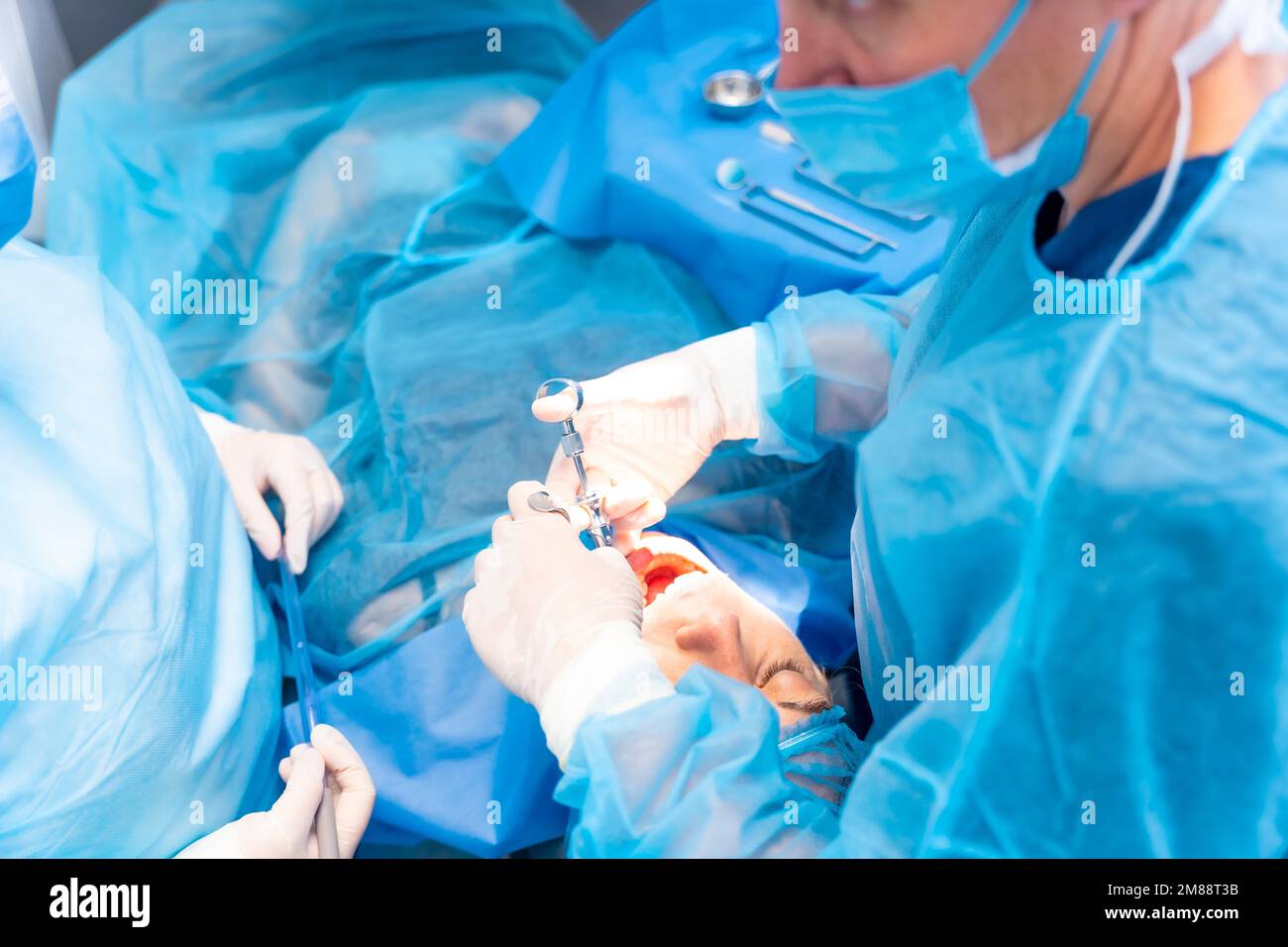 Dental clinic, dentist doctor applying anesthesia injection to patient