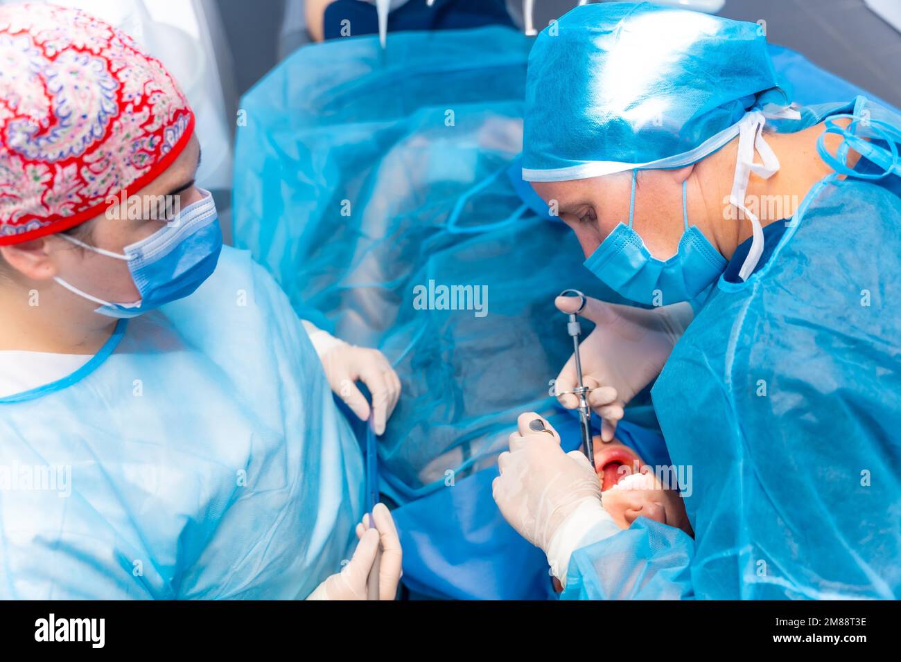 Dental clinic, dentist doctor applying an injection to the patient