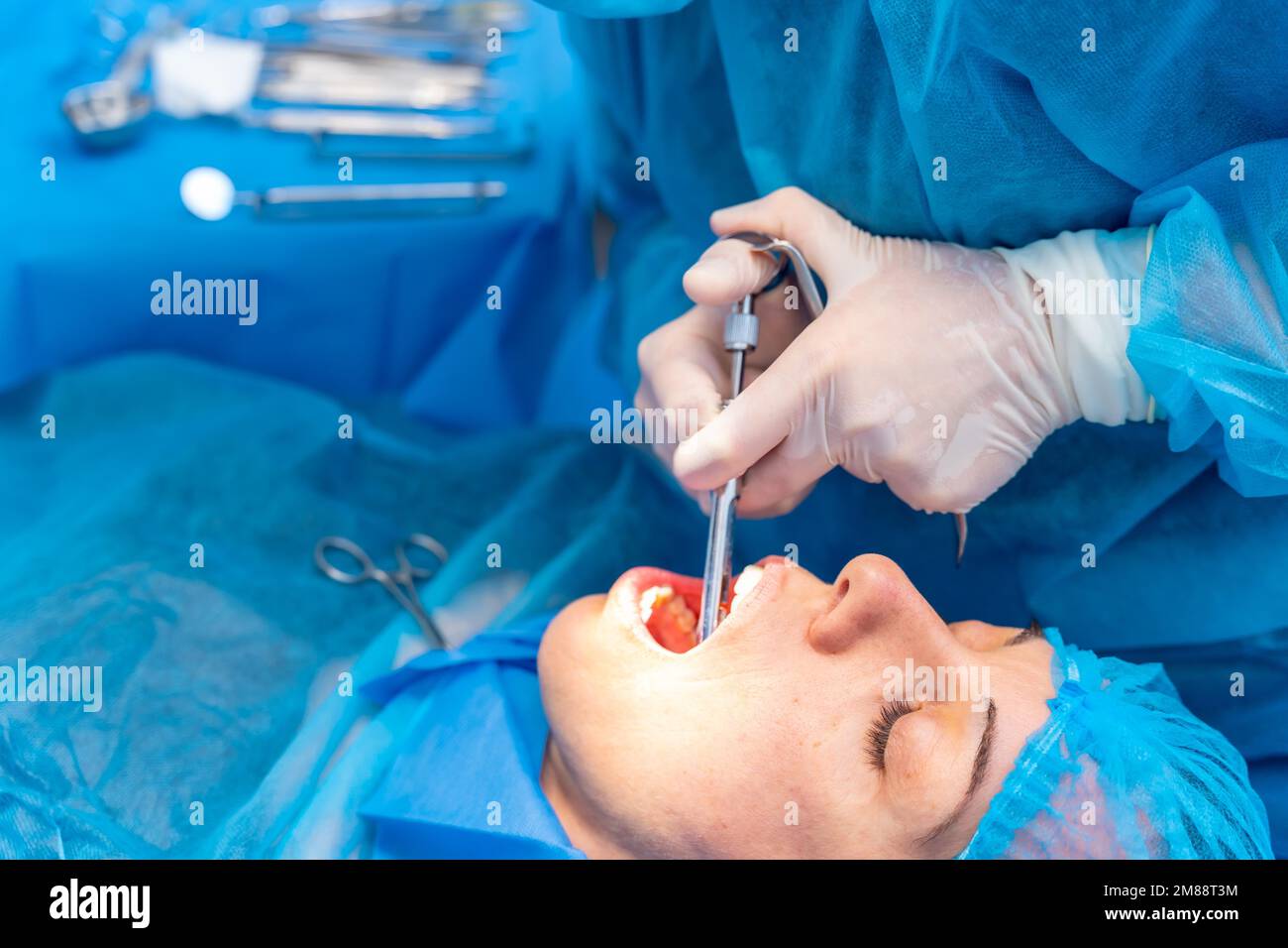 Dental clinic, female dentist doctor applying anesthesia injection