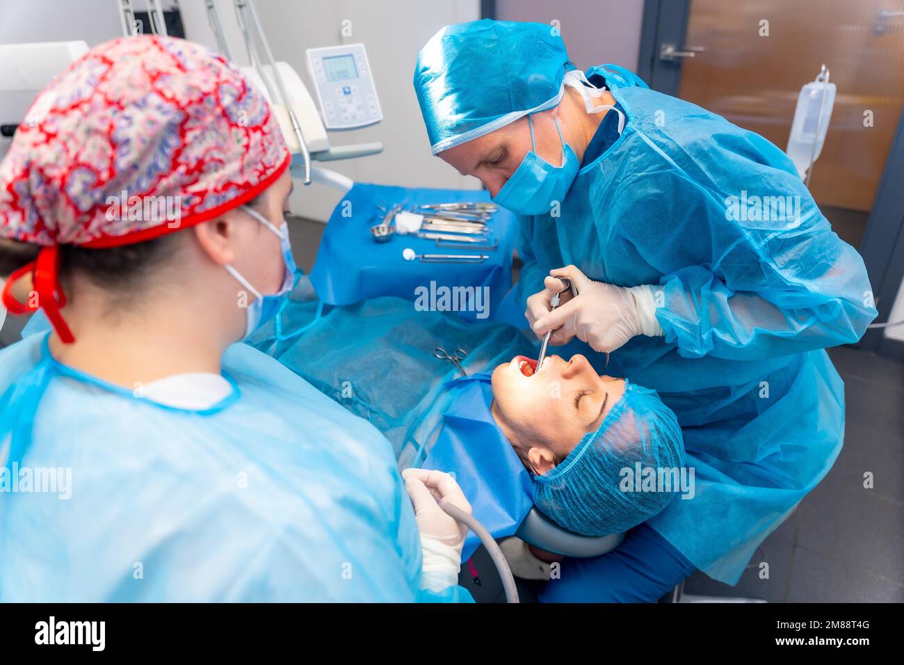 Dental clinic, female dentist doctor applying anesthesia injection