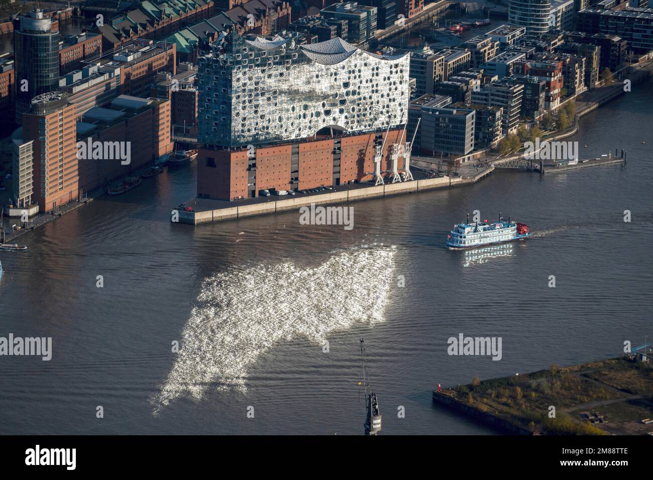 Aerial view of the Elbe Philharmonic Hall with reflection in the Elbe, visitor ship sails through the reflection, paddle steamer, music house Stock Photo