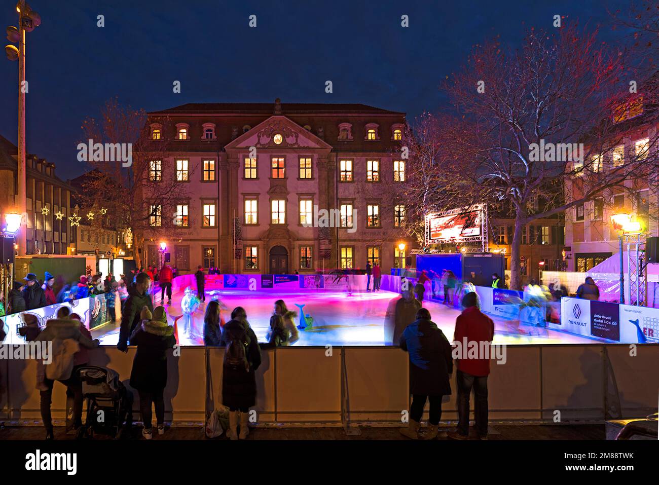 Artificial skating rink in the evening illumination, Erlangen, Middle Franconia, Bavaria, Germany Stock Photo