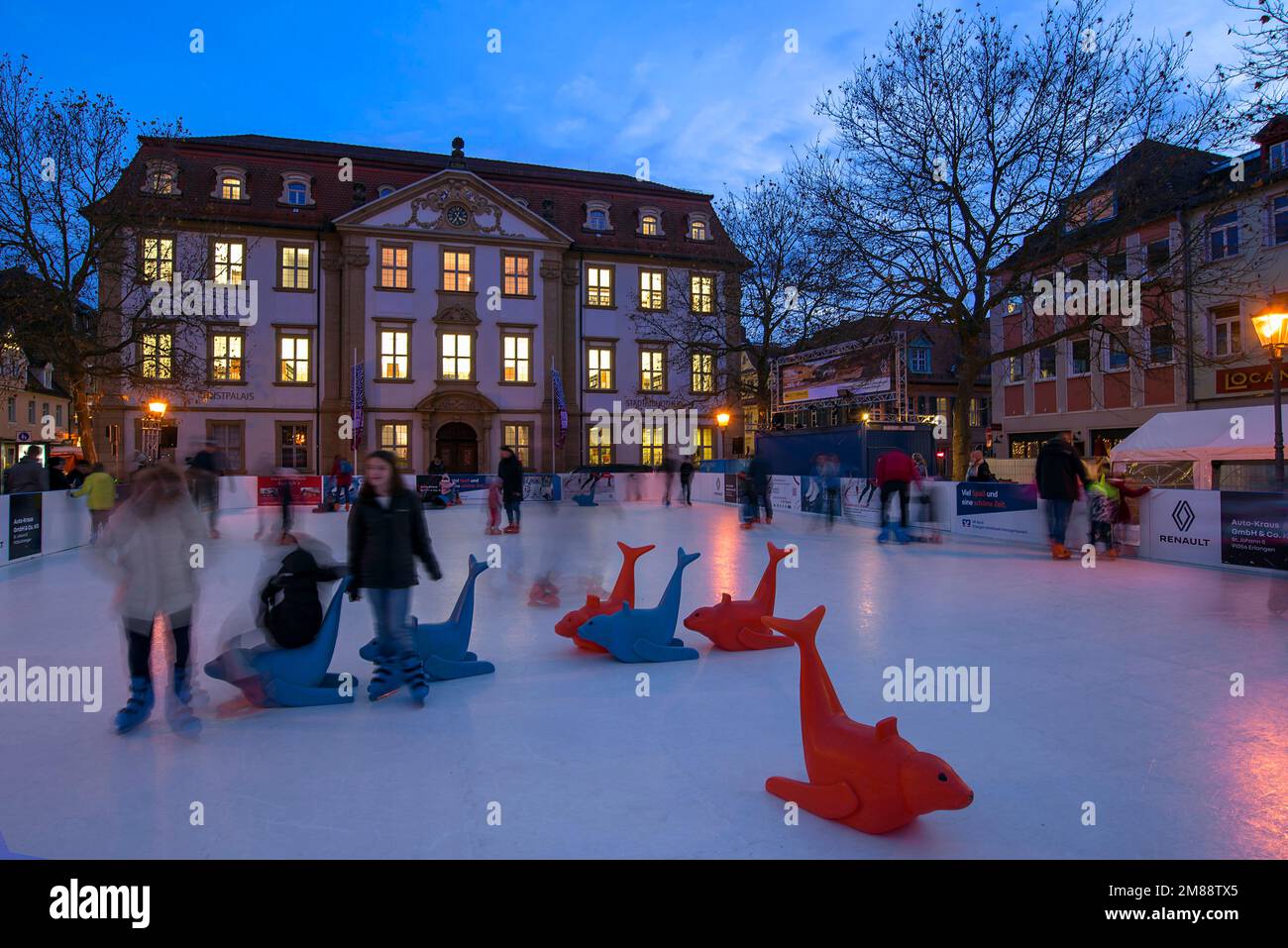 Ice skating rink in colourful evening lighting, Erlangen, Middle