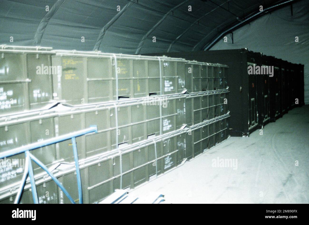 Containers are stored in a pre-positioning cave which holds U.S. Marine ...