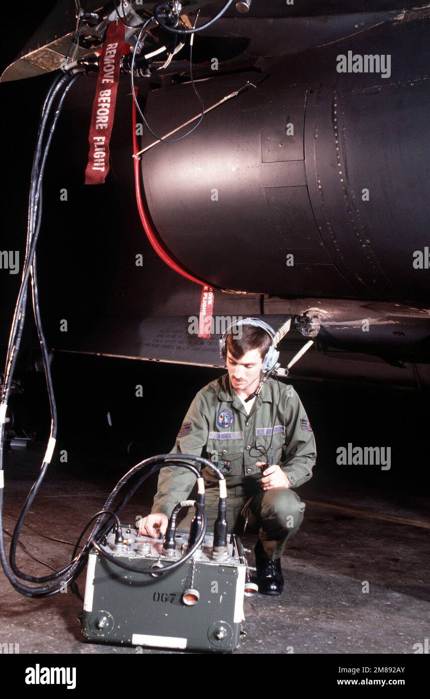A technician conducts a flight system inspection on a 509th Bombardment ...
