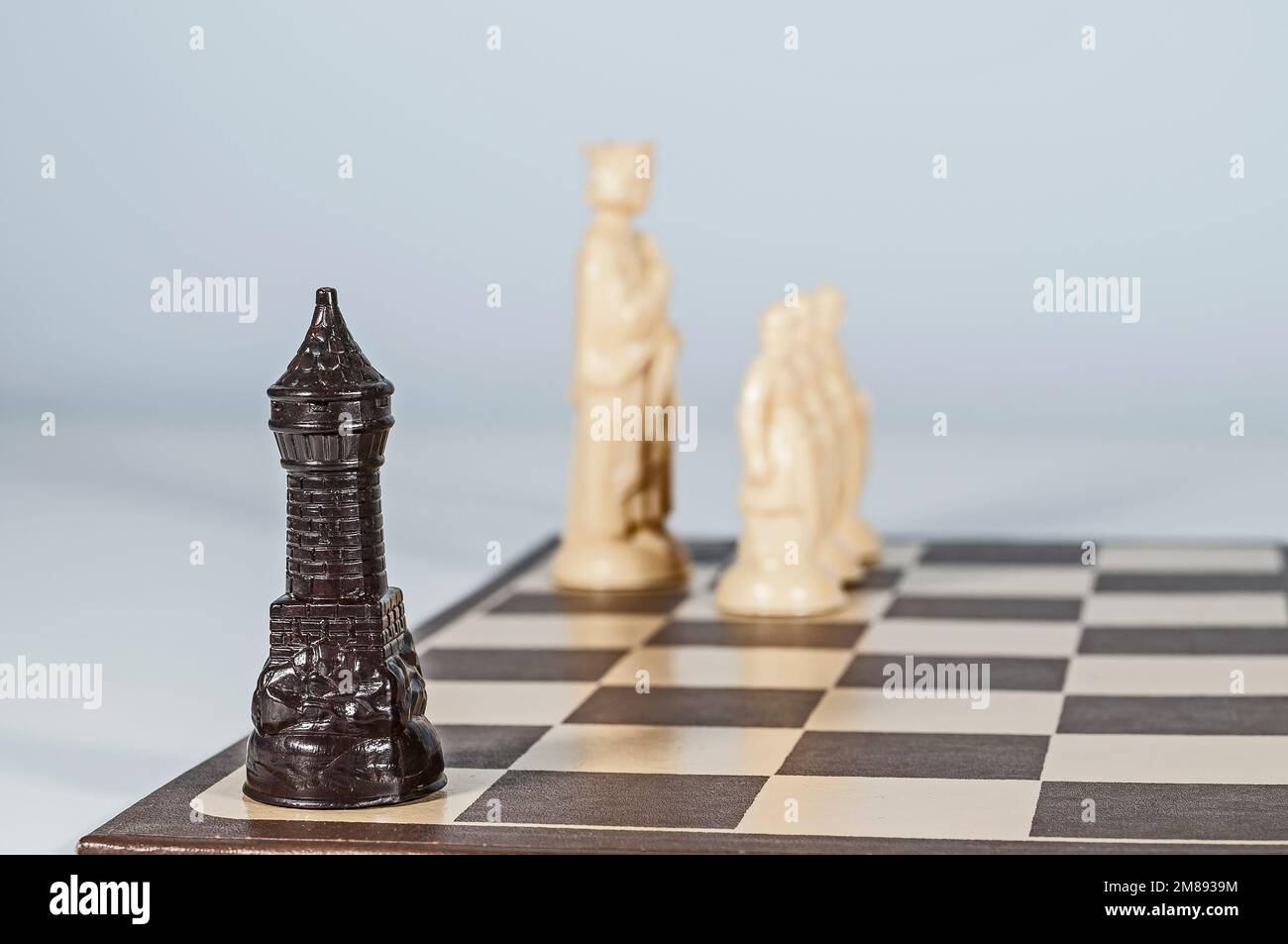 Chess Board with King, Queen and Rook in Checkmate Stock Photo - Alamy