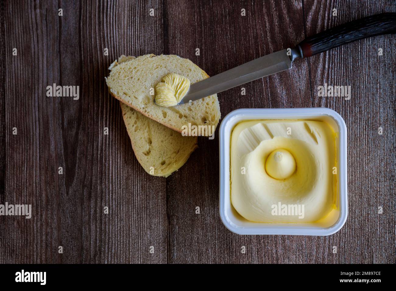 Creamy butter spread on slice of bread Stock Photo - Alamy