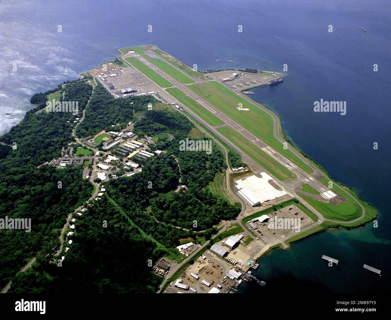An aerial view of the runway and flight line. Base: Naval Air Station ...