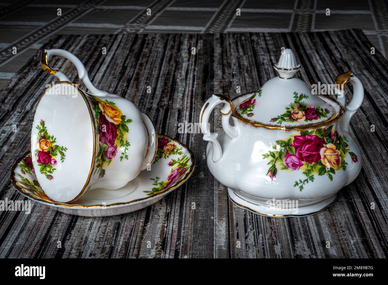 Royal Albert porcelain tableware, sugar bowl and coffee cup. Hand-painted flowers. Can be used to illustrate porcelain dishes in newspapers. Stock Photo