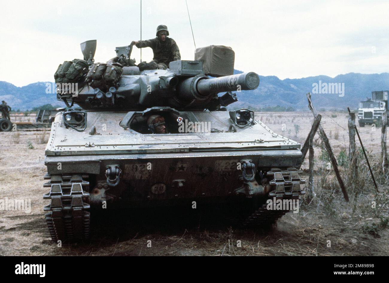 An M-551A1 Sheridan tank from the 3rd Bn., 73rd Armor, 82nd Abn. Div.,  moves out after being offloaded from a convoy vehicle. President Ronald  Reagan mobilized U.S. exercise task force DragonGolden Pheasant,
