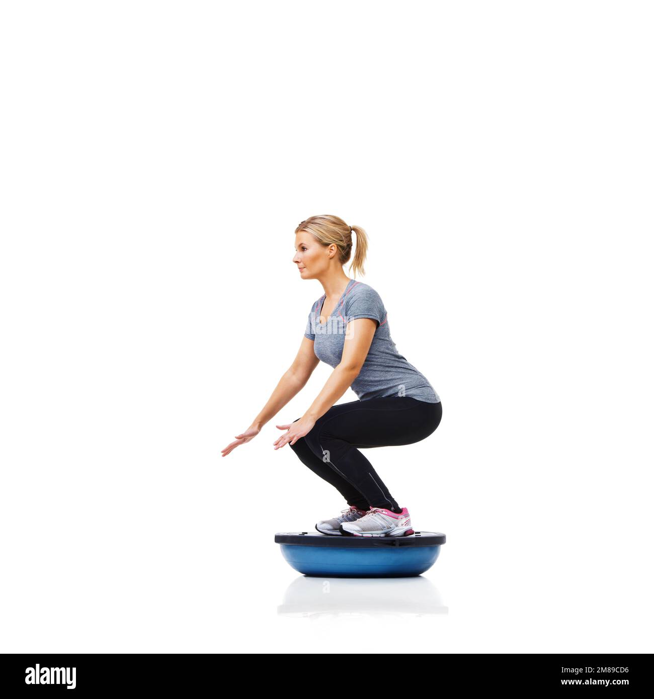 Balance is key to improving core strength. A beautiful young woman