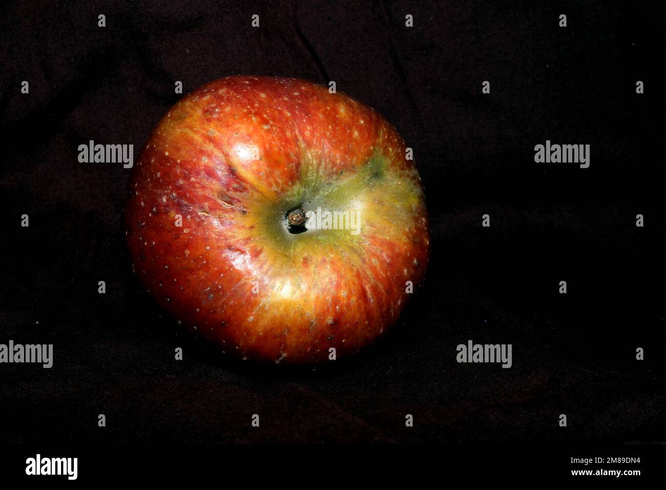 fresh sweet red apple isolated on black background Stock Photo