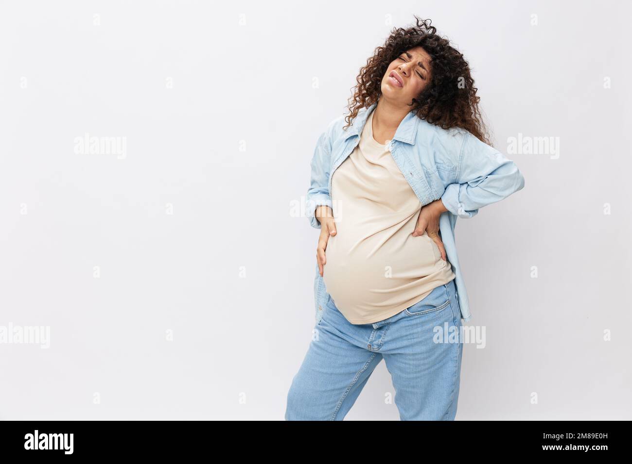 Pregnant woman tired, headache and abdominal pain, heavy pregnancy