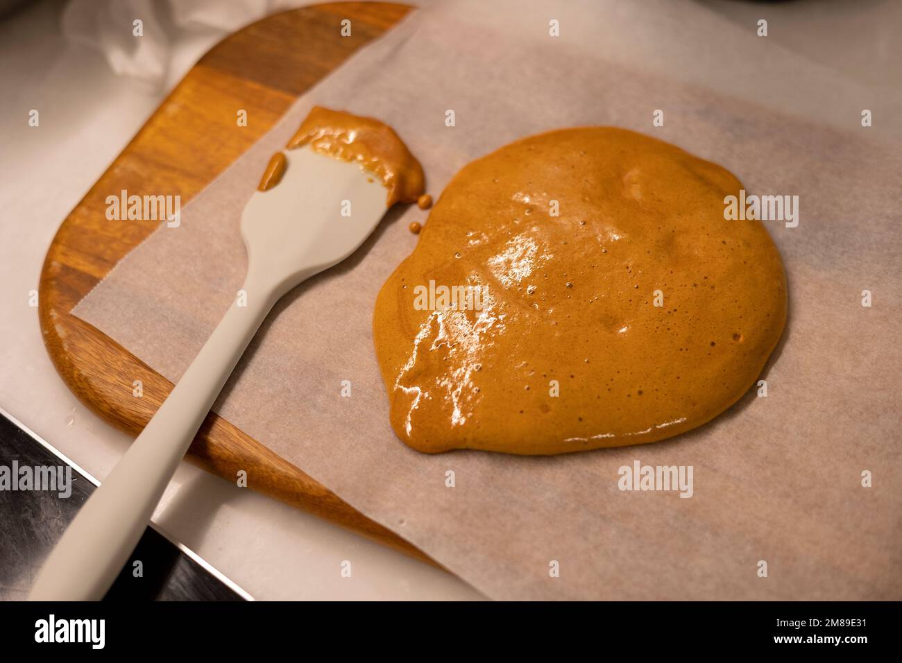 Making giant sugar cookie, dalgona and spatula on the cooking wax paper