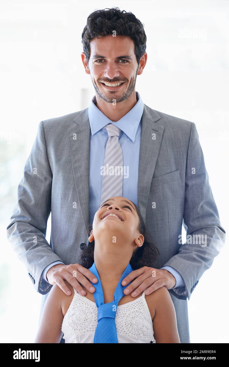 Shes the light of my life. Portrait of a handsome father standing behind his young daughter. Stock Photo
