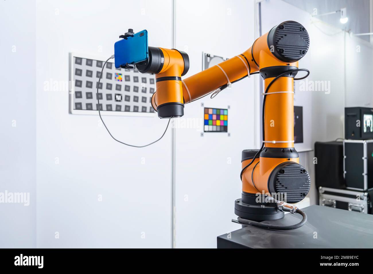 Robotic artificial automated manufacturing smart robot holding mobile phone Stock Photo