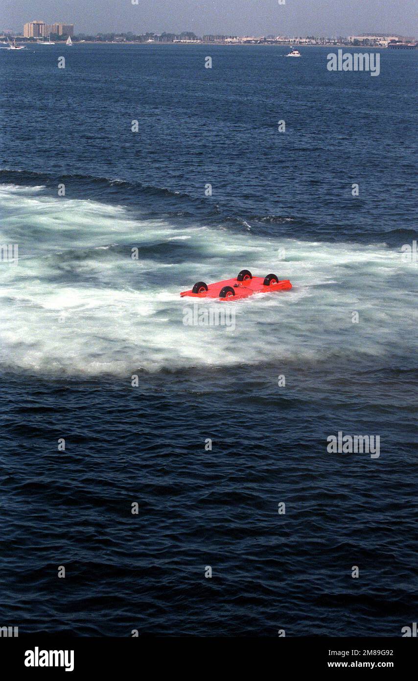 An overturned 52,700-pound sled floats in the water after being ...