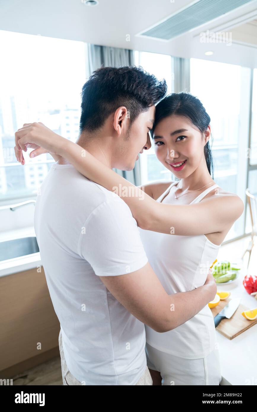 Young couples in the kitchen Stock Photo