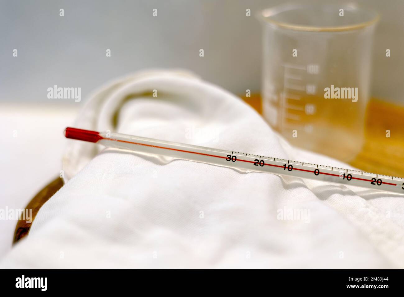 The beakers and the gradations on a thermometer in the laboratory Stock