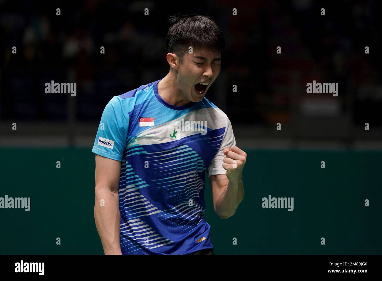 Singapores Loh Kean Yew reacts during his mens singles quarterfinals match against Thailands Kunlavut Vitidsarn at the Malaysia Open badminton tournament at the Bukit Jalil Axiata Arena in Kuala Lumpur, Malaysia, Friday,
