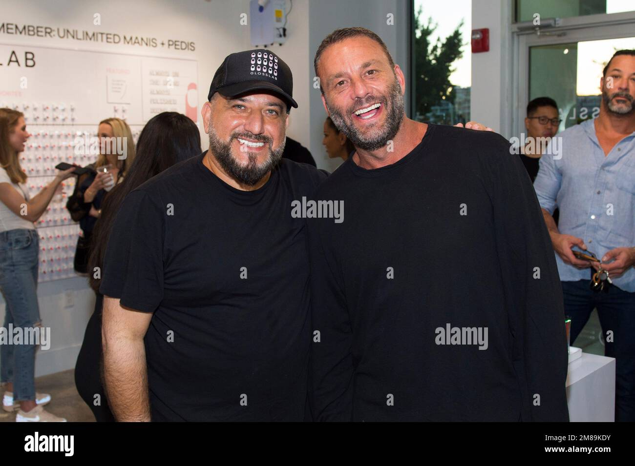 David "Papi" Einhorn, left, and Dave Grutman attend the grand opening