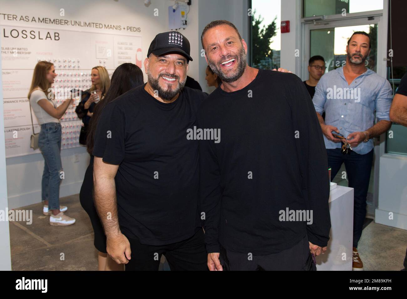 David "Papi" Einhorn, left, and Dave Grutman attend the grand opening