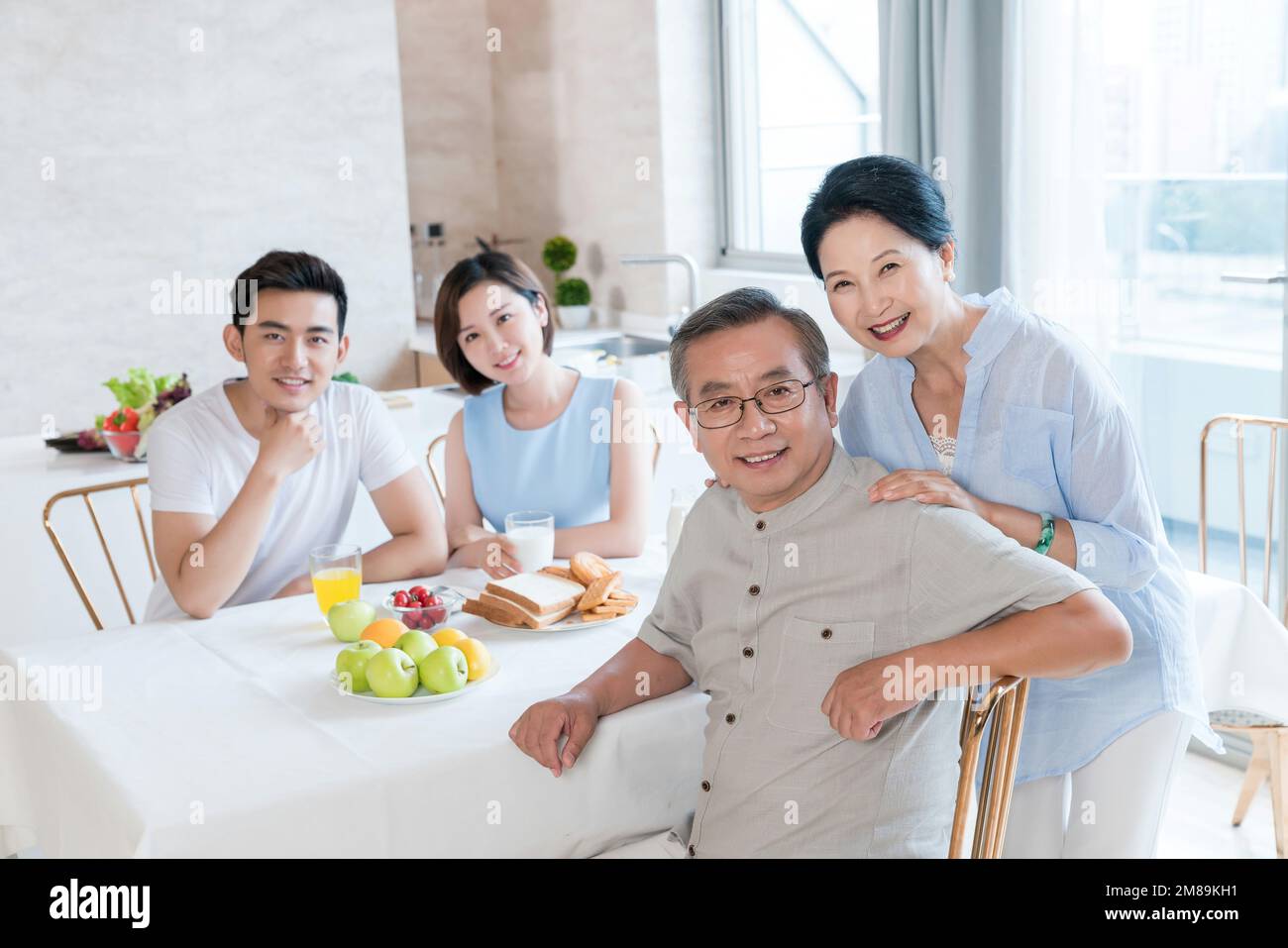 Happy family dinner in the kitchen Stock Photo