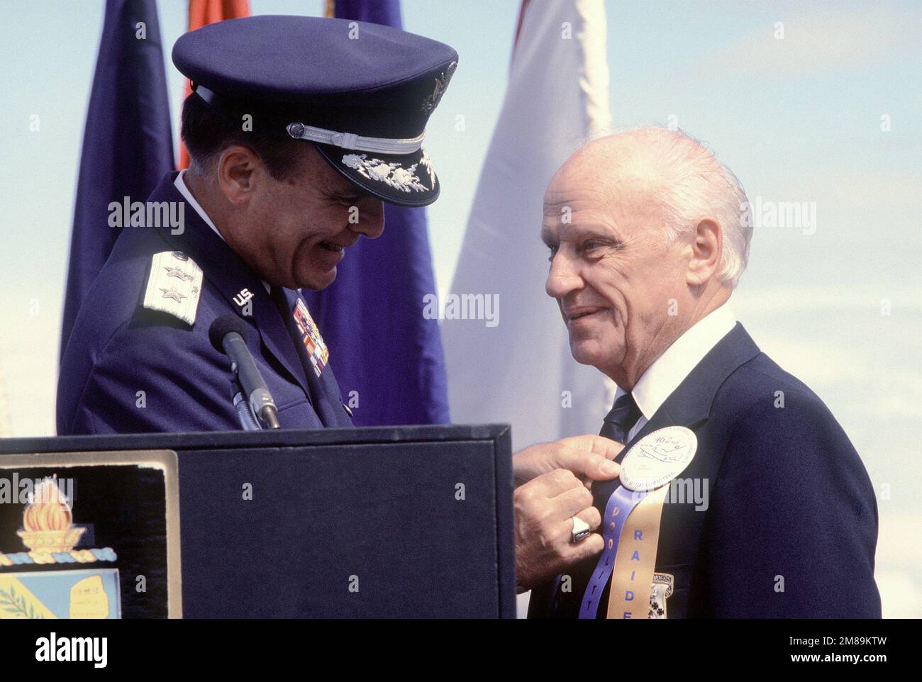 Jacob D. DeShazer, one of Doolittle's Raiders, receives his POW/MIA medal for service in World War II from Major General Alexander K. Davidson, commander, 22nd Air Force, Military Airlift Command. Base: Nav Post Grad School, Monterey State: California (CA) Country: United States Of America (USA) Stock Photo