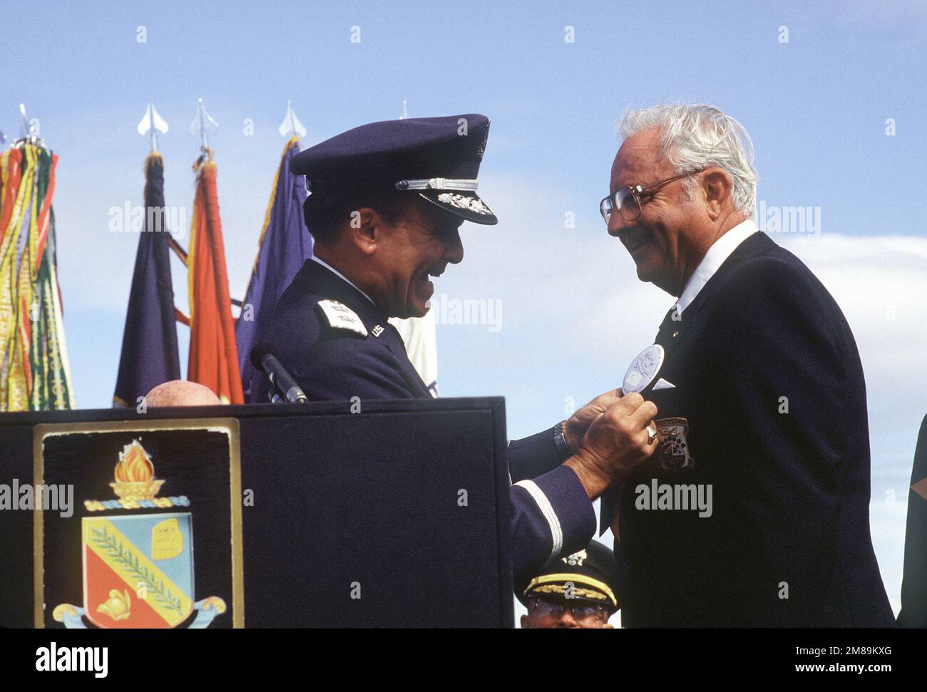 David M. Jones, one of Doolittle's Raiders, receives his POW/MIA medal for service in World War II from Major General Alexander K. Davidson, commander, 22nd Air Force, Military Airlift Command. Base: Nav Post Grad School, Monterey State: California (CA) Country: United States Of America (USA) Stock Photo