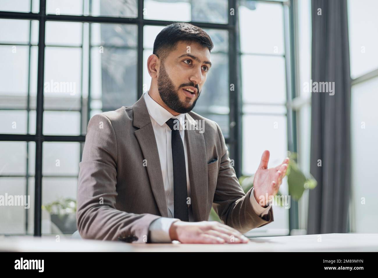 two professional businessmen discussing and using desktop computer in office Stock Photo