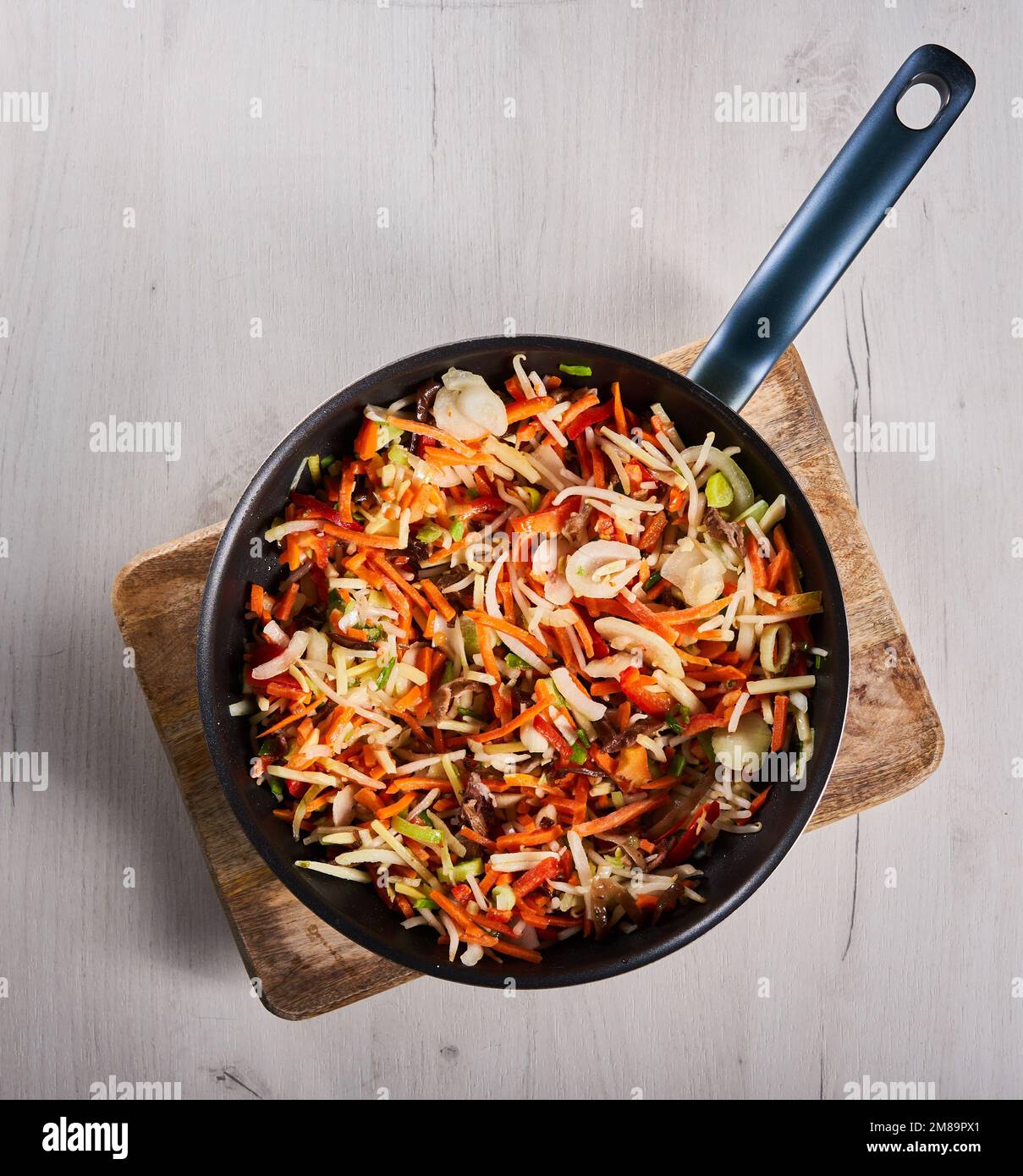 Stir fry frozen vegetables in the wok Stock Photo - Alamy