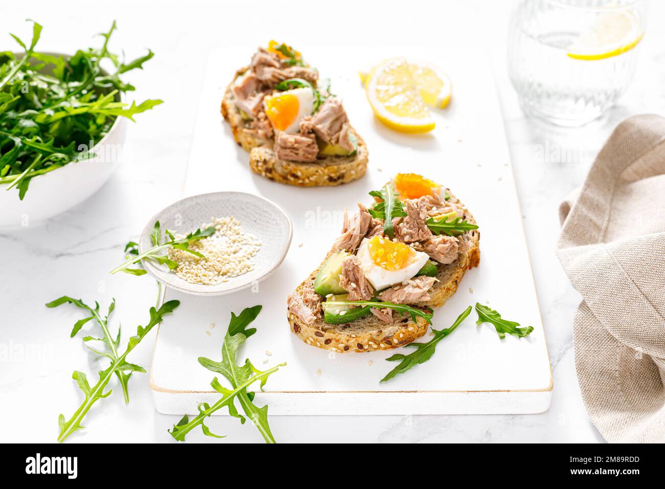 Tuna toast. Open sandwiches with whole grain bread, canned tuna, boiled
