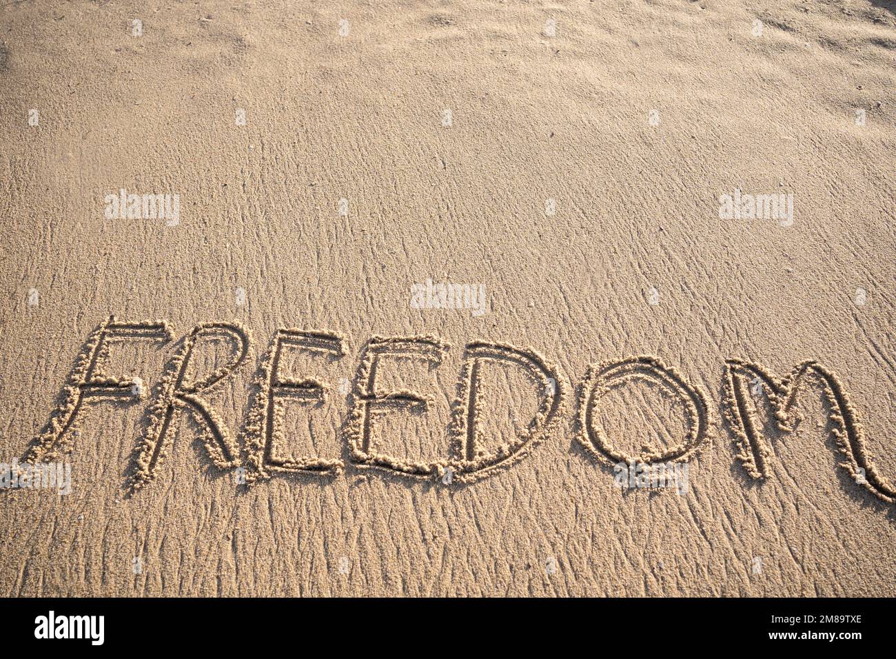 Positive message in sand hi-res stock photography and images - Alamy