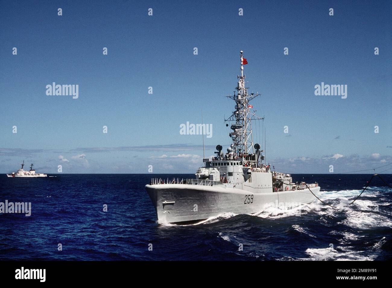 The Canadian frigate HMCS TERRA NOVA (F-259) refuels from the ...