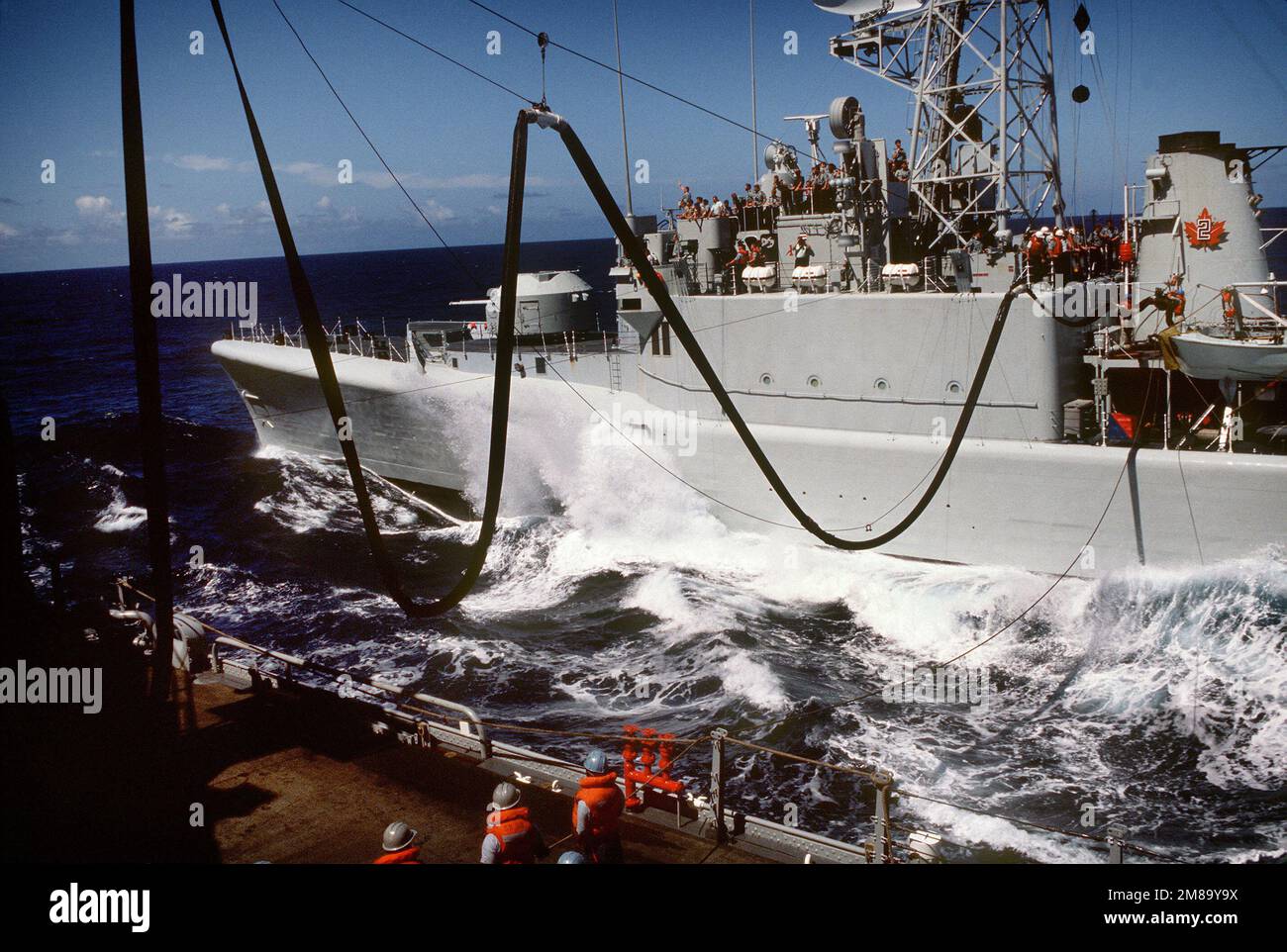 The Canadian frigate HMCS TERRA NOVA (F-259) refuels from the ...