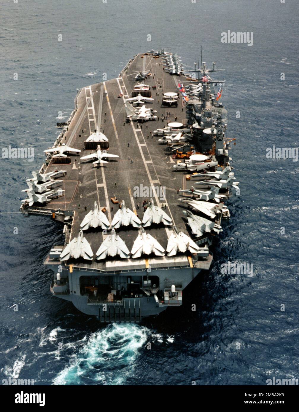 A stern view of the nuclear-powered aircraft carrier USS THEODORE ROOSEVELT (CVN-71) underway. Country: Unknown Stock Photo