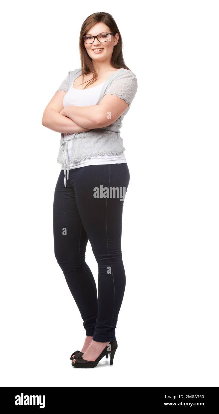 Full-bodied confidence. A pretty full-figured woman posing confidently on a white background. Stock Photo