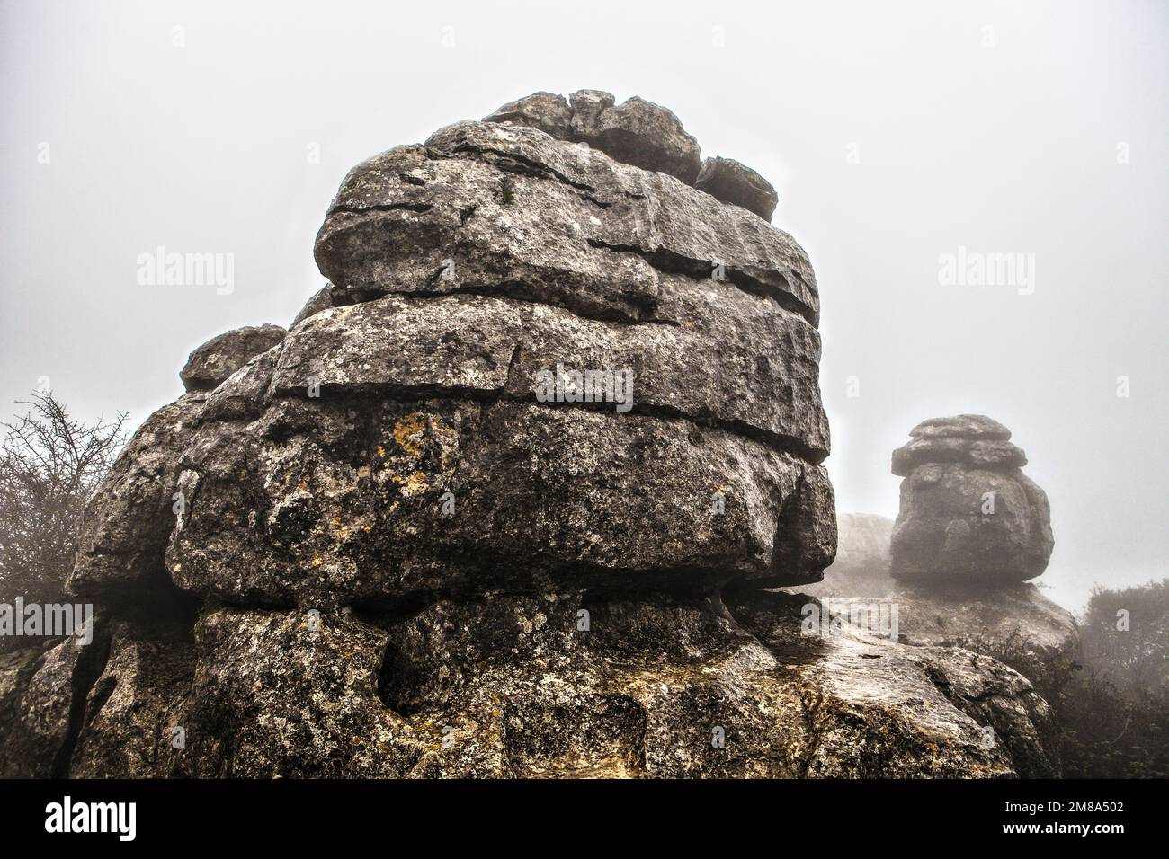 El Torcal De Antequera in the fog, Malaga, Spain. Unusual stunning rock formation Stock Photo