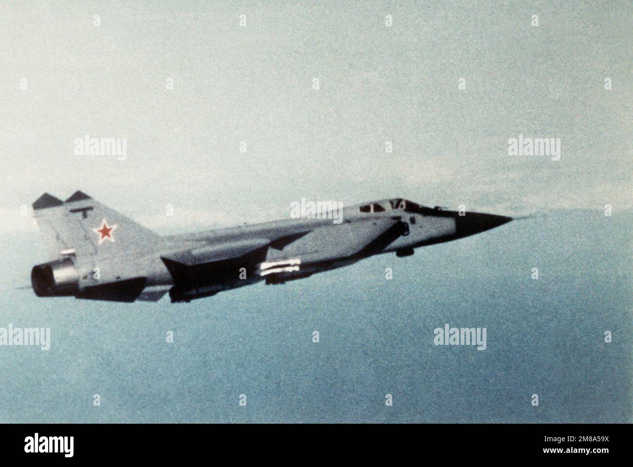 An air-to-air right side view of a Soviet MiG-31 Foxhound aircraft. Country: Unknown Stock Photo