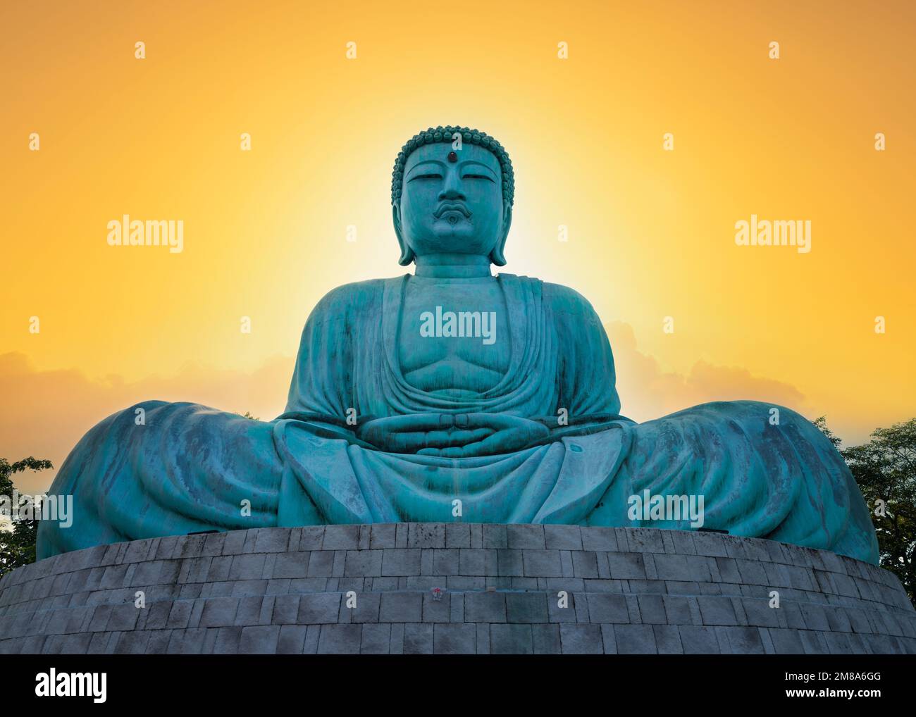 Great Buddha or Kamakura Daibutsu statue at sunset time. The ornate