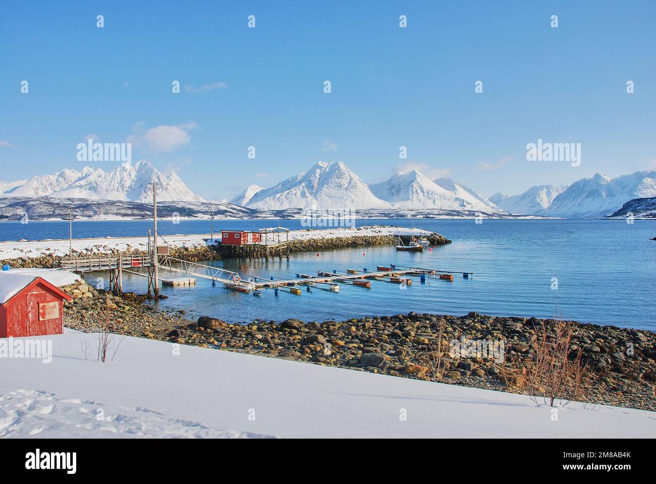 Winter Landscape With Snow Covered Mountains And A Red Fisher Hut On A ...