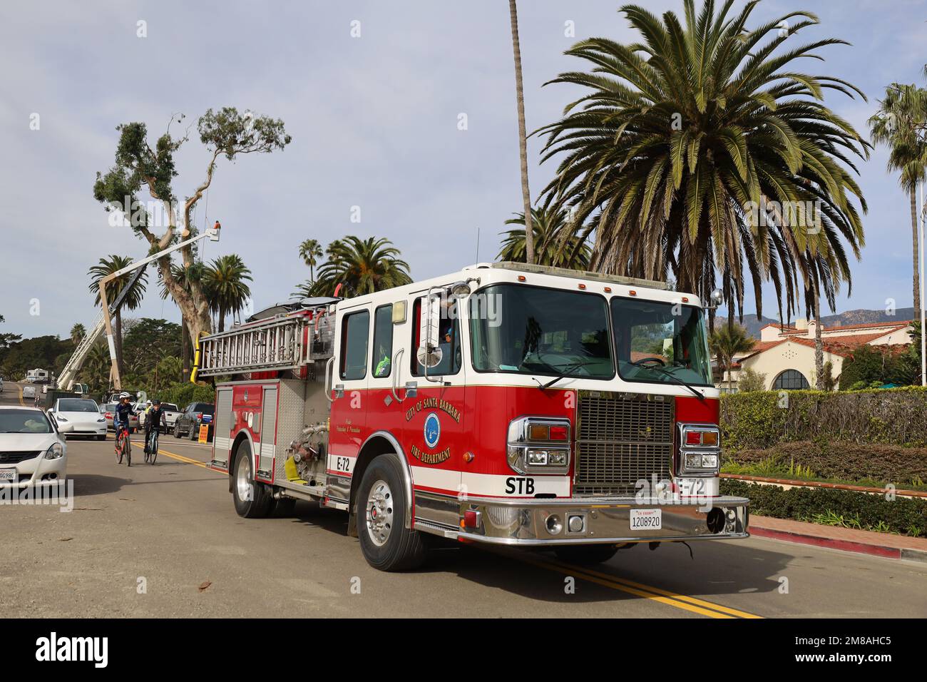 Montecito, California, U.S.A. 12th Jan, 2023. A red Fire Engine passes by the Four Seasons Biltmore Hotel is cutting down all their giant Eucalyptus trees as a safety measure after one came crashing down on the luxury resort property and across Olive Mill Road. The beautiful palm trees will remain. (Credit Image: © Amy Katz/ZUMA Press Wire) EDITORIAL USAGE ONLY! Not for Commercial USAGE! Stock Photo