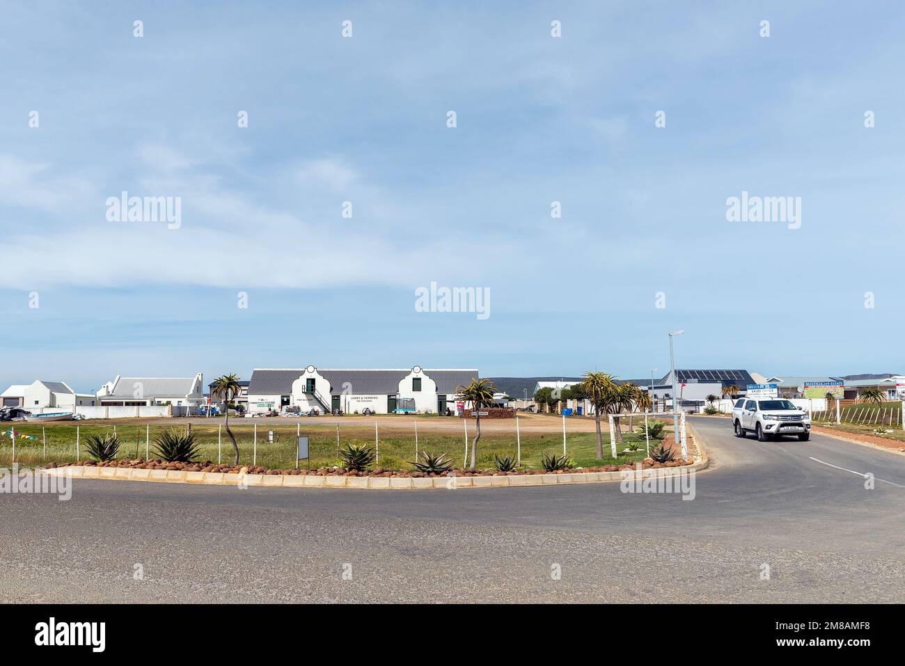 Witsand, South Africa - Sep 24, 2022: A street scene, with the historic Barry and Nephews Woolshed, in Port Beaufort at Witsand in the Western Cape Pr Stock Photo