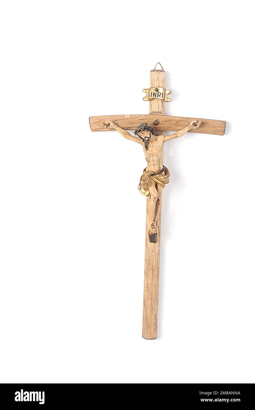 Set of Christmas nativity scene, angel figurines and hanging crucifix isolated on white background. Christmas and Easter Stock Photo