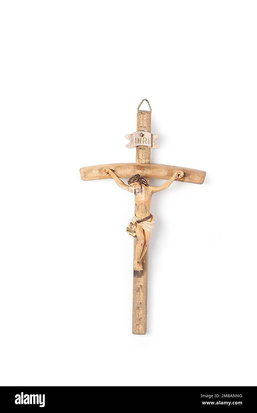 Set of Christmas nativity scene, angel figurines and hanging crucifix isolated on white background. Christmas and Easter Stock Photo